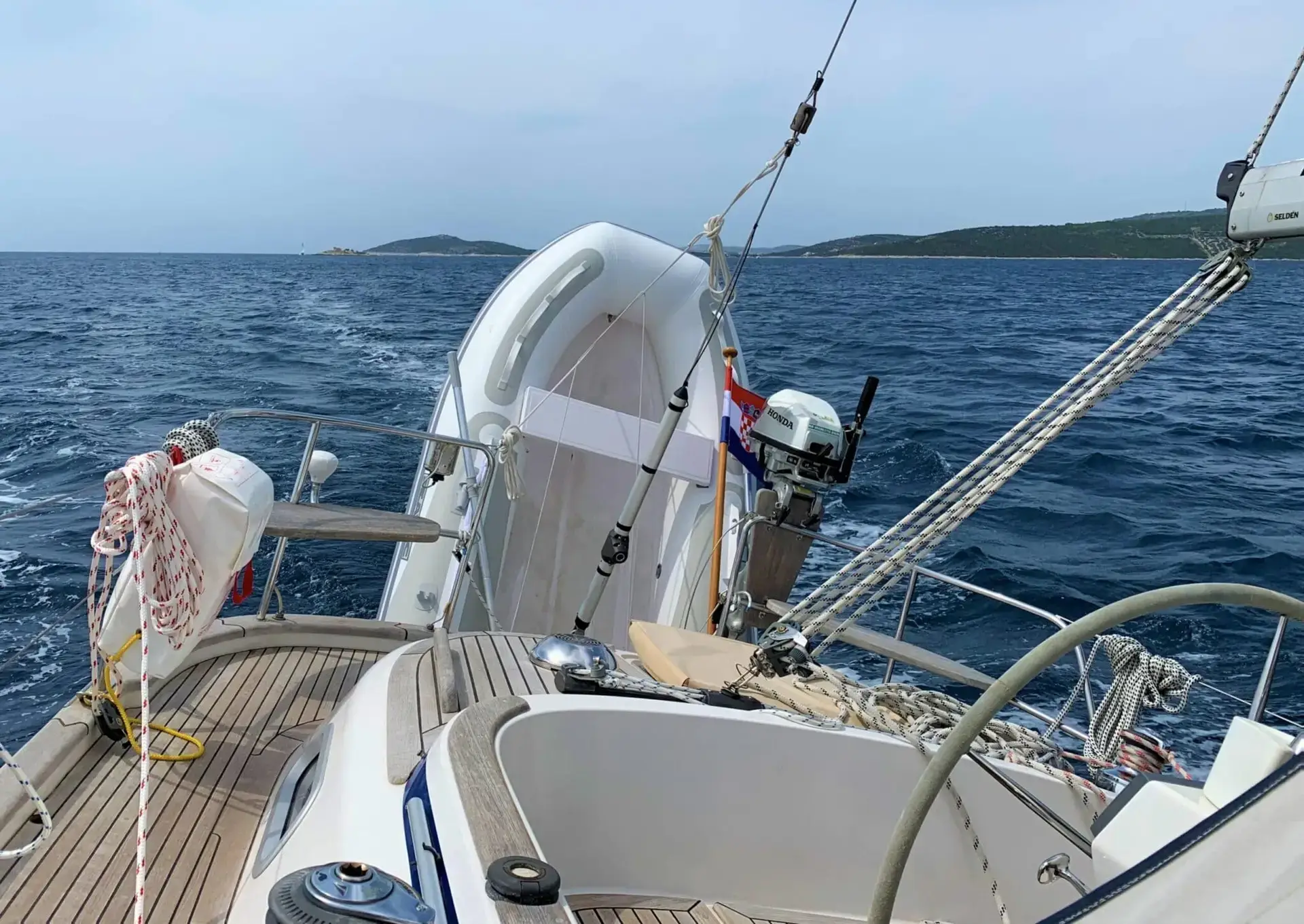 TenderConnect dinghy transport system secured at yacht stern while sailing